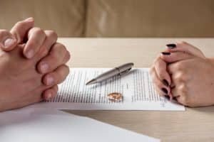 divorce papers in front of couple