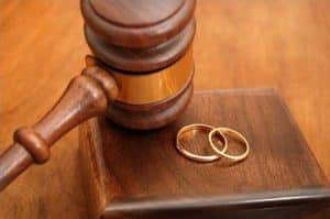 gavel with wedding rings